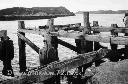 The old Pier at Loch Skipport, looking ever more dilapidated after the storms of winter 2004/5. Pictured at Easter 2005.
