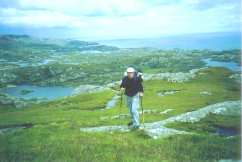 Me, Tommy Dalnaes, walking up Eaval Mountain on a lovely day in june 2002. Her further up I lost my glasses, worth £ 525 !! What a loss - I hope that someone will find them and give them to Lochmaddy Police - they have a note of lost properties. But it was a fantastic day allthough.