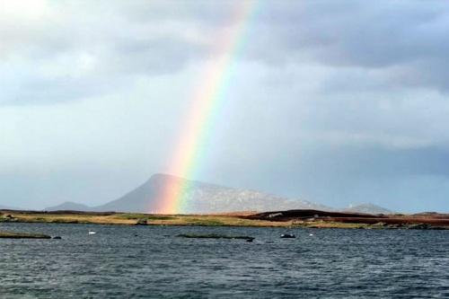 A rainbow complementing Eaval, view from east Olavat, near the north west shoulder of Rueval