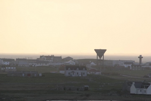 Balivanich with the Monach Isles in the background. You can just make out the lighthouse to the left or the wine glass looking structure.