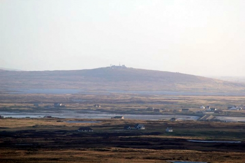 Rueval, South Uist, viewed from the summit of Rueval, Benbecula. You can see the causeway to the right. Looks small.