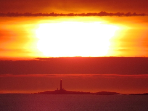 Is the Monach Light working overtime? - the sun sinking through a high level mist bank