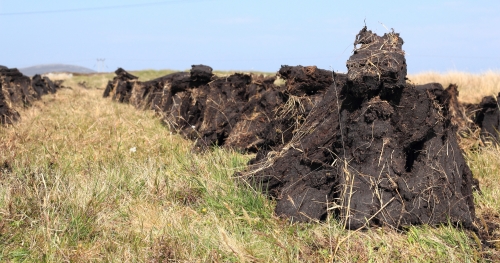 Stacking the peats at Lionacleit, July 2013